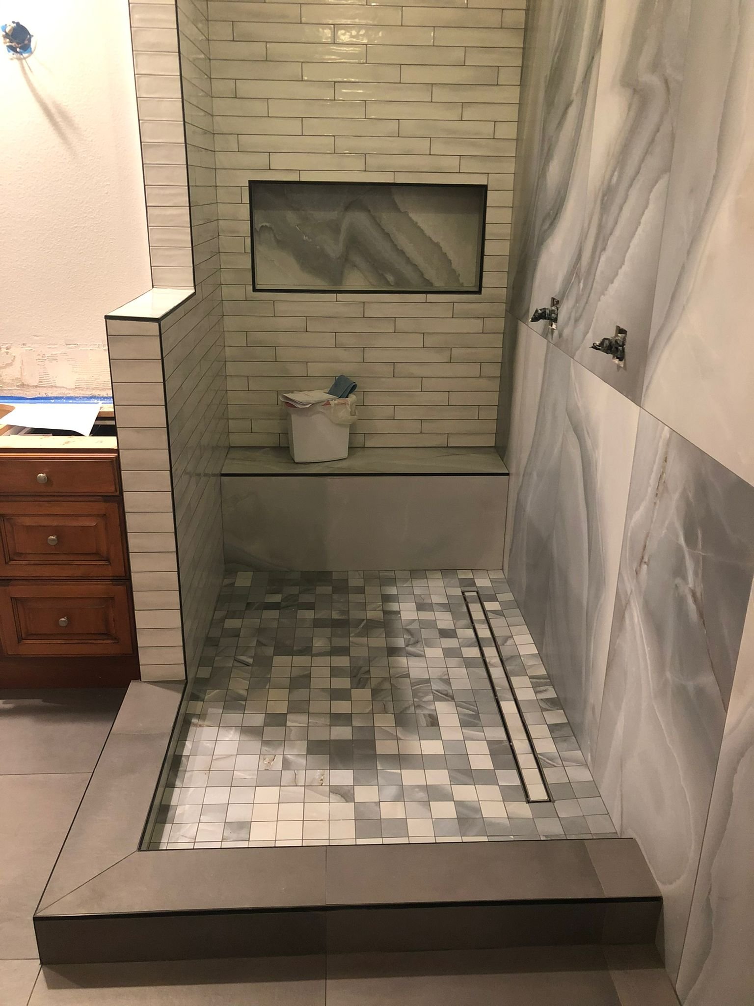 Subway Tile Shower with Mosaic Floor